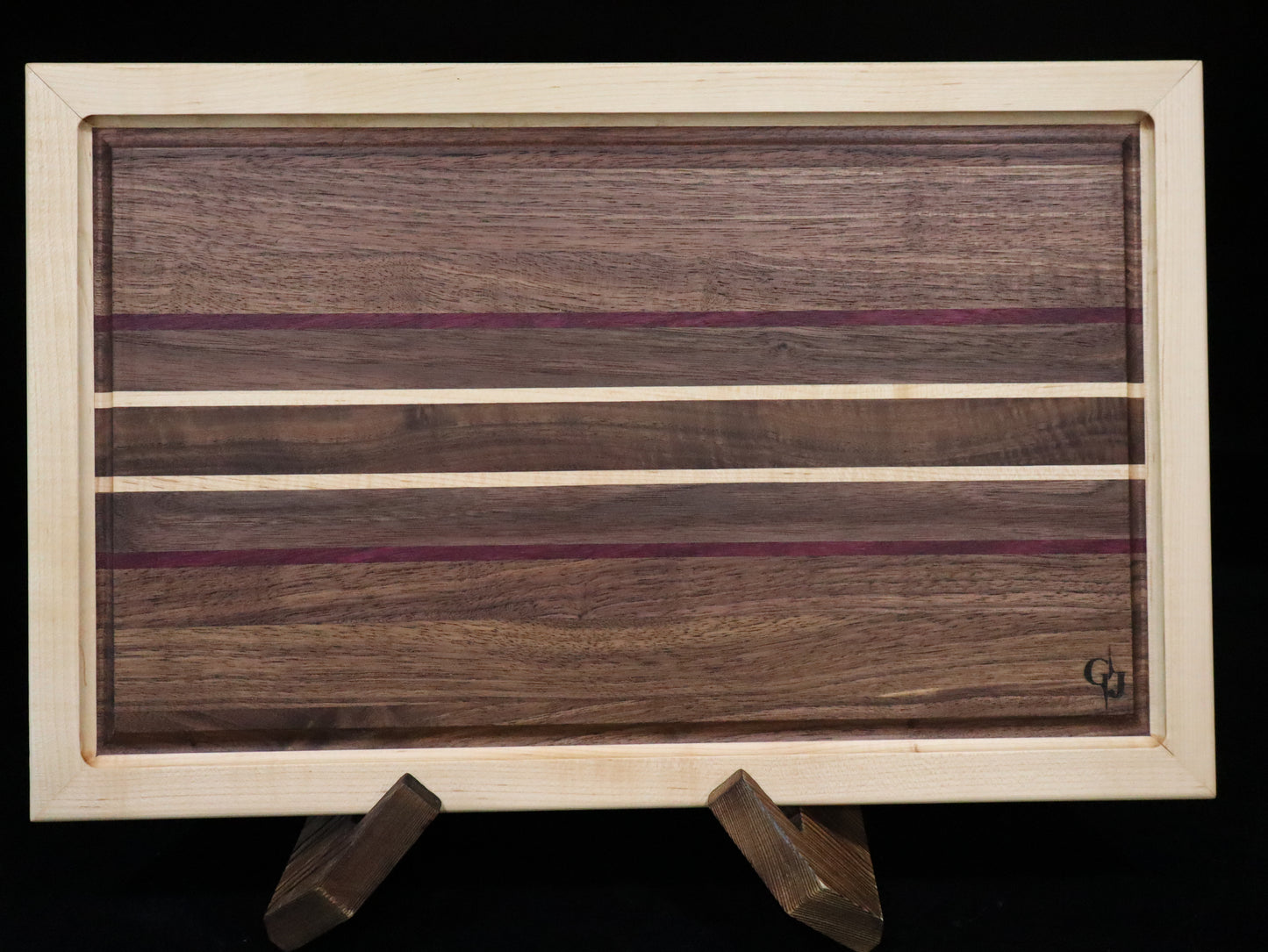 Walnut/Purple Heart Cutting Board framed in Maple