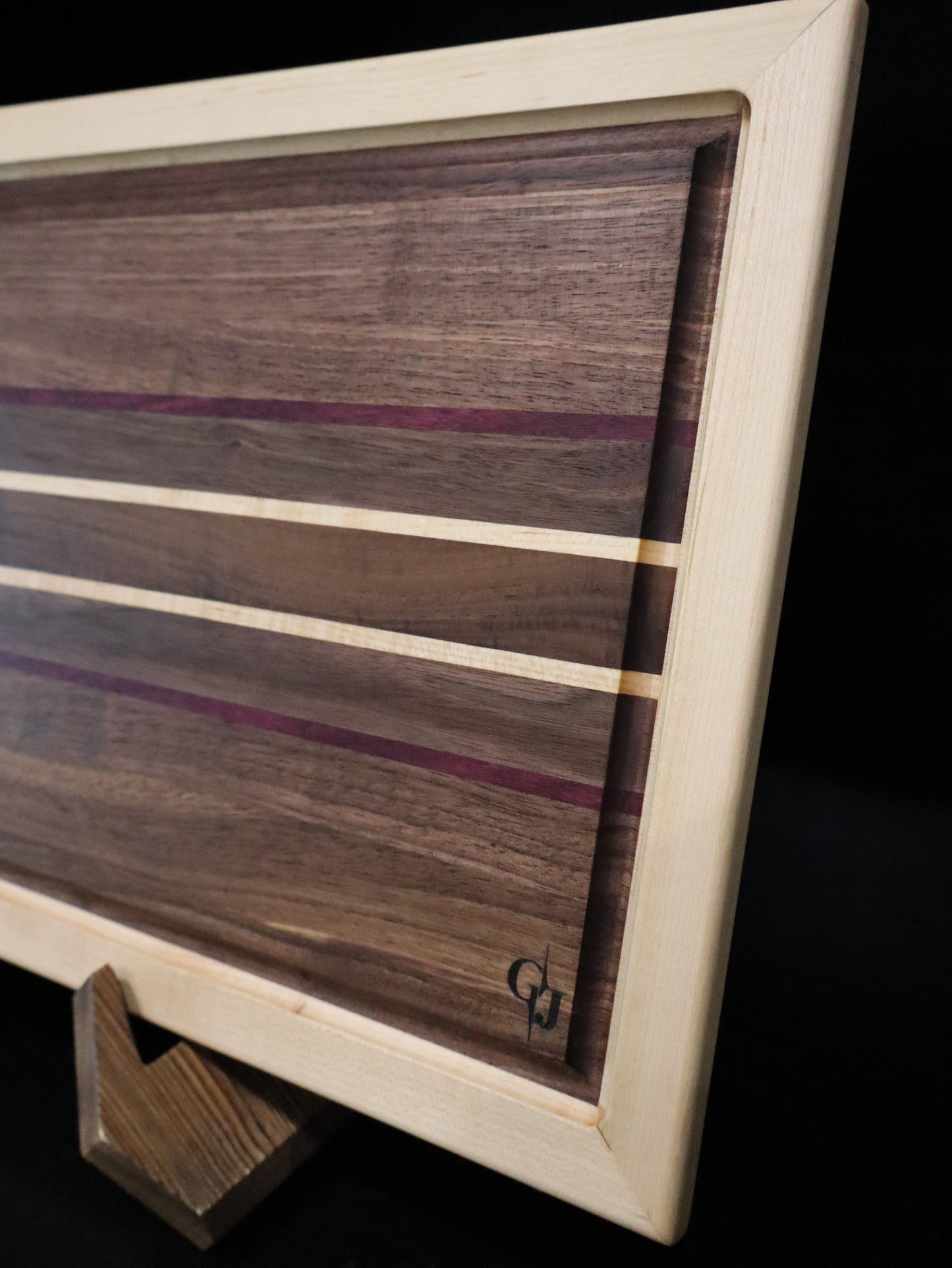 Walnut/Purple Heart Cutting Board framed in Maple