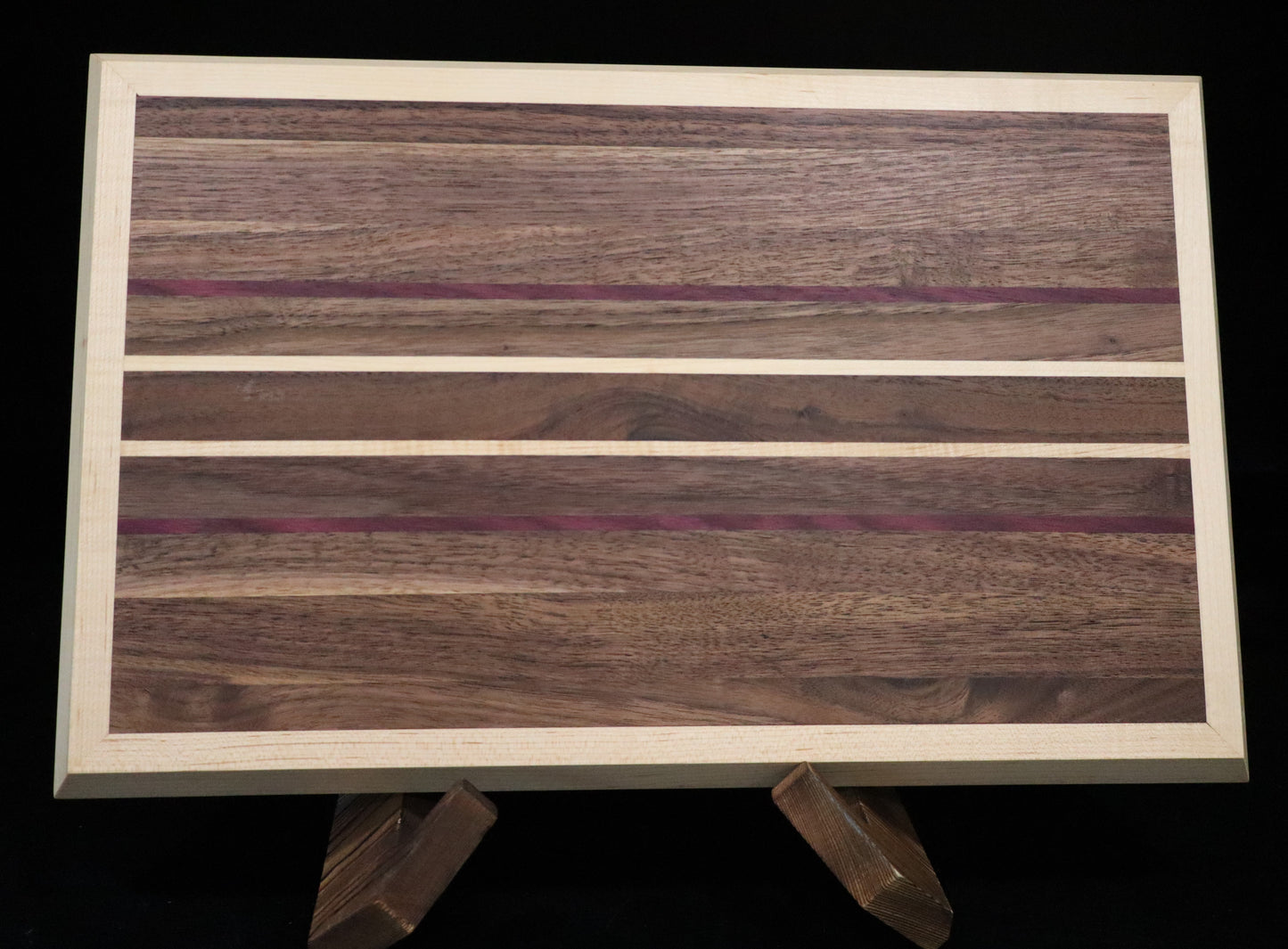 Walnut/Purple Heart Cutting Board framed in Maple