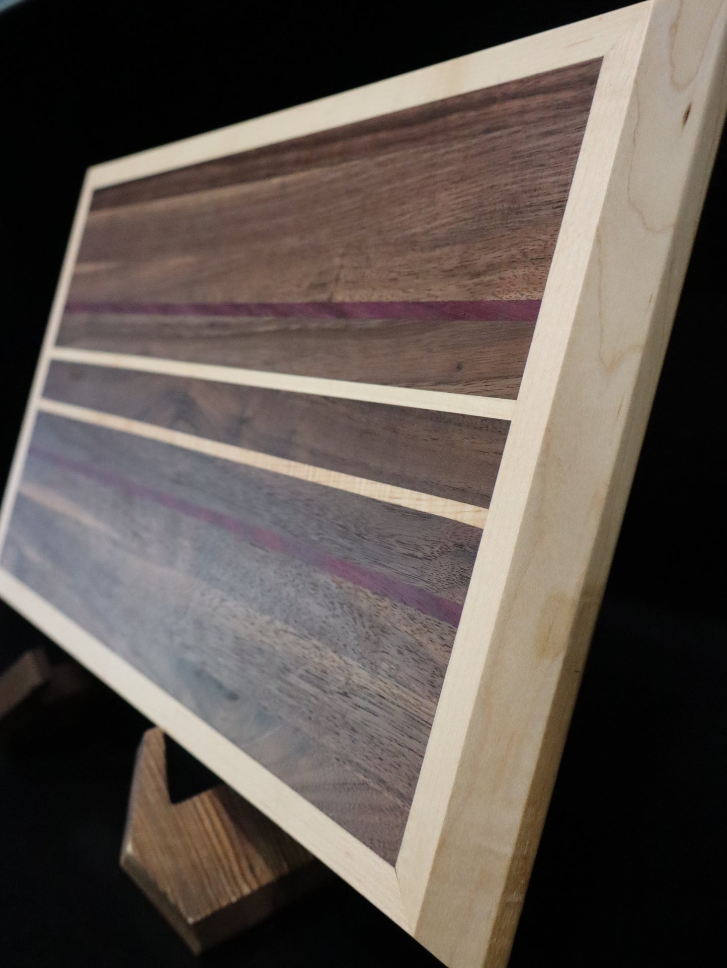 Walnut/Purple Heart Cutting Board framed in Maple