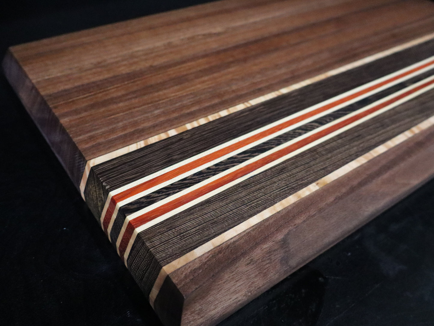 Walnut, Paduk, Maple, and Wenge Edge-Grain Cutting Board